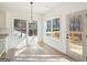 Sunlit breakfast area with hardwood floors, backyard view, and access to the deck at 3279 Greenhill Dr, Villa Rica, GA 30180