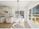 Cozy breakfast area with backyard view, modern chandelier, and access to outdoor living at 3279 Greenhill Dr, Villa Rica, GA 30180
