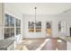 Bright dining area with wood floors, large windows, and access to the deck at 3279 Greenhill Dr, Villa Rica, GA 30180