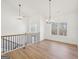 Elegant dining area with hardwood floors, modern lighting, and large windows at 3279 Greenhill Dr, Villa Rica, GA 30180