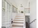 Inviting entryway with wood stairs and railing leads to the home's living spaces at 3279 Greenhill Dr, Villa Rica, GA 30180