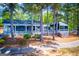 Exterior view of a waterfront restaurant with a charming patio, perfect for relaxing by the water at 3279 Greenhill Dr, Villa Rica, GA 30180