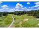 Picturesque golf course featuring manicured greens, sand traps, and a winding path under a blue sky at 3279 Greenhill Dr, Villa Rica, GA 30180