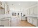 Bright, open kitchen boasts white cabinets, granite countertops, and stainless steel appliances at 3279 Greenhill Dr, Villa Rica, GA 30180