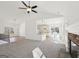 Open-concept living room boasts a stone fireplace and seamless flow to the kitchen at 3279 Greenhill Dr, Villa Rica, GA 30180