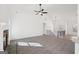 Bright and airy living room featuring high ceilings, fireplace, and contemporary ceiling fan at 3279 Greenhill Dr, Villa Rica, GA 30180