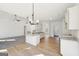 Open concept living space with modern kitchen, hardwood floors, and natural light at 3279 Greenhill Dr, Villa Rica, GA 30180