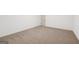 Spacious room features neutral walls and plush brown carpeting, complemented by white baseboards at 3279 Greenhill Dr, Villa Rica, GA 30180