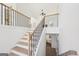 Beautiful staircase with wood and iron railing leading to the second floor at 3279 Greenhill Dr, Villa Rica, GA 30180