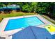 Aerial view of community pool and tennis courts, offering residents recreational amenities in a serene setting at 3279 Greenhill Dr, Villa Rica, GA 30180