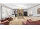 Cozy living room features a stone fireplace, plush seating, and a traditional design aesthetic for comfortable living at 75 Antioch Rd, Mcdonough, GA 30252