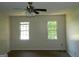 Spacious bedroom with two windows bringing in natural light, and ceiling fan at 3683 Brown Dr, Decatur, GA 30034