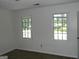 Bedroom features two windows for natural light and ample space at 3683 Brown Dr, Decatur, GA 30034