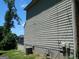 Side view of home showing vinyl siding, utilities and a partial view of the backyard at 3683 Brown Dr, Decatur, GA 30034