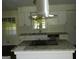 Bright kitchen featuring an island with granite countertops and stainless steel appliances at 3683 Brown Dr, Decatur, GA 30034