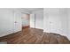 Open bedroom space showcasing modern wood flooring and white doors at 768 Great Oak Place # 26, Villa Rica, GA 30180