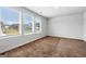 Bright bedroom with verdant neighborhood views through the windows, featuring plush carpeting and neutral walls at 768 Great Oak Place # 26, Villa Rica, GA 30180