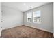 Neutral bedroom with large windows providing natural light and views of the neighborhood at 768 Great Oak Place # 26, Villa Rica, GA 30180