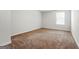 A bright bedroom with soft carpet and natural light from a window at 768 Great Oak Place # 26, Villa Rica, GA 30180