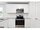 Bright kitchen showcasing stainless steel appliances, granite countertops, and neutral paint at 768 Great Oak Place # 26, Villa Rica, GA 30180