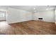 Bright living room featuring wood flooring, white walls, and a modern fireplace at 768 Great Oak Place # 26, Villa Rica, GA 30180