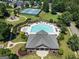 Overhead view of a community pool, clubhouse, tennis court and playground at 169 Wallnut Hall Cir, Woodstock, GA 30189