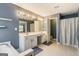 Bathroom with a large mirror, a double vanity, and a built-in tub at 169 Wallnut Hall Cir, Woodstock, GA 30189