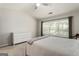 Bright bedroom with a large window, vaulted ceiling, and white dresser at 169 Wallnut Hall Cir, Woodstock, GA 30189