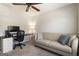 Bedroom with a sofa, desk, and a ceiling fan providing ample space at 169 Wallnut Hall Cir, Woodstock, GA 30189