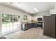 Bright kitchen with modern appliances, two-tone cabinets, and a sliding door to the backyard at 169 Wallnut Hall Cir, Woodstock, GA 30189