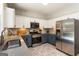Well-appointed kitchen with stainless steel appliances, stylish backsplash, and ample counter space at 169 Wallnut Hall Cir, Woodstock, GA 30189