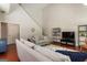 Living room boasts neutral tones, large windows and comfortable seating at 169 Wallnut Hall Cir, Woodstock, GA 30189