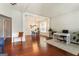 Bright and airy living room featuring hardwood floors and an open concept design at 169 Wallnut Hall Cir, Woodstock, GA 30189