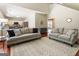 Spacious living room with hardwood floors and easy access to a modern, well-equipped kitchen at 169 Wallnut Hall Cir, Woodstock, GA 30189