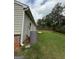 Green backyard surrounded by mature trees at 170 Forray Dr, Covington, GA 30016