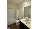 Bright bathroom with a shower-tub combo, modern vanity, and neutral finishes at 170 Forray Dr, Covington, GA 30016