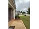 Charming home exterior with brick accents, a welcoming porch, and lush landscaping at 170 Forray Dr, Covington, GA 30016