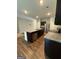 Open concept kitchen with granite countertops, stainless appliances, and island at 170 Forray Dr, Covington, GA 30016