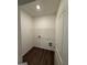 Functional laundry room with overhead shelving and convenient access at 170 Forray Dr, Covington, GA 30016