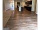 Spacious living area featuring a kitchen island, hardwood flooring, and an open floor plan at 170 Forray Dr, Covington, GA 30016