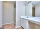 Neutral bathroom featuring a large mirror, a vanity with storage, and a glass enclosed shower at 5640 Terremont Cir, Norcross, GA 30093