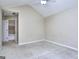 Bedroom featuring carpet floors with and an attached bathroom with tile tub/shower enclosure at 5640 Terremont Cir, Norcross, GA 30093