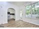 Dining area featuring modern flooring, bright windows, and access to the kitchen at 5640 Terremont Cir, Norcross, GA 30093
