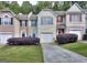 Charming townhouses with manicured lawns and colorful window shutters at 5640 Terremont Cir, Norcross, GA 30093