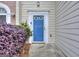 Inviting entryway featuring a blue front door and neat landscaping at 5640 Terremont Cir, Norcross, GA 30093