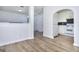 Open-concept space showcasing the kitchen with white cabinets and appliances at 5640 Terremont Cir, Norcross, GA 30093