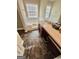 Bathroom features include brown tile flooring, soaking tub, and a long vanity at 11657 Flemming Ct, Hampton, GA 30228