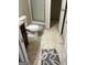 Modest bathroom featuring a toilet, shower with glass doors, and outdated flooring at 11657 Flemming Ct, Hampton, GA 30228