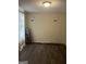 Bedroom with new floors and waiting for new tenant's decorative vision at 11657 Flemming Ct, Hampton, GA 30228