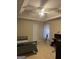 Cozy bedroom features a ceiling fan, neutral walls, and carpet flooring at 11657 Flemming Ct, Hampton, GA 30228